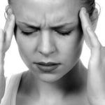 Person suffering with a headache